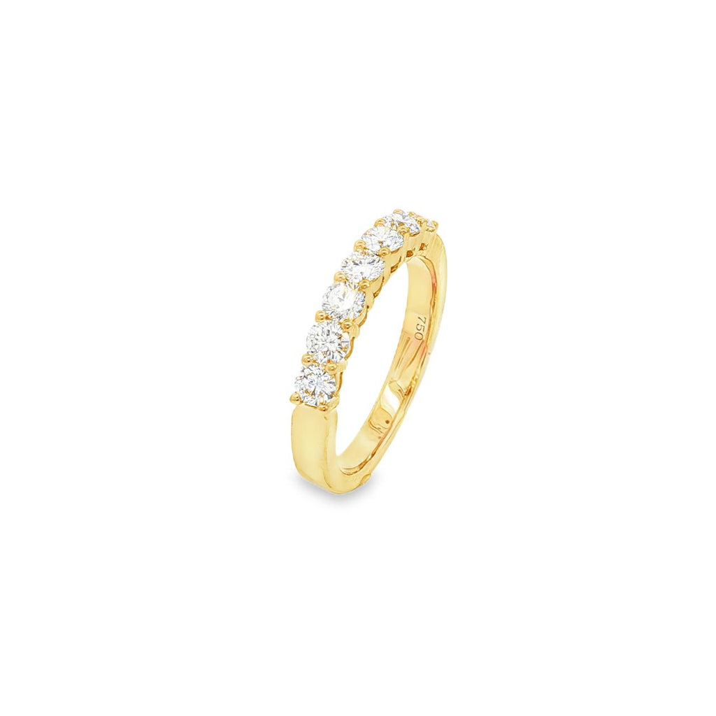 18ct yellow gold diamond ring featuring seven round brilliant cut diamonds in a straight row claw setting across the top.