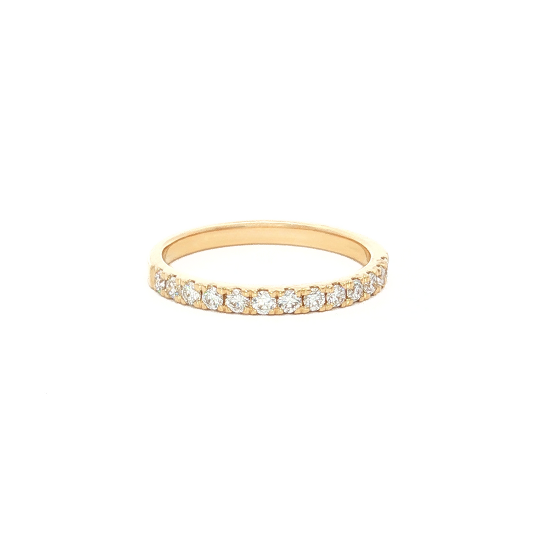 18ct yellow gold diamond wedding ring featuring a claw-set row of round brilliant cut diamonds across the top.