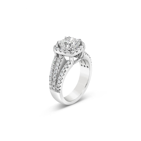 Platinum cushion cut diamond halo ring featuring a 2.00ct centre diamond with a halo surround and triple split diamond-set shoulders.