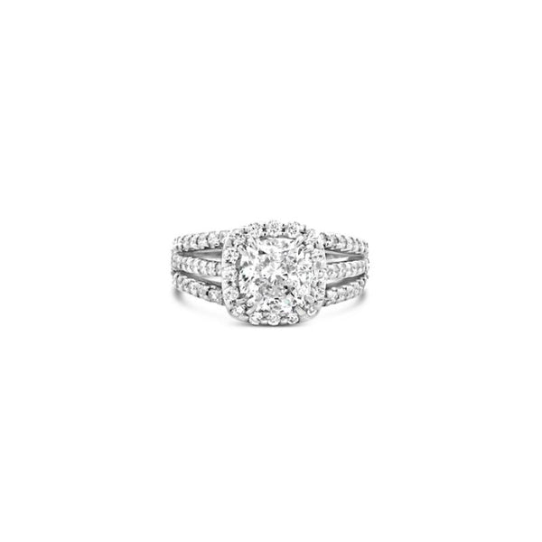 Platinum cushion cut diamond halo ring featuring a 2.00ct centre diamond with a halo surround and triple split diamond-set shoulders.