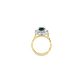 18ct yellow and white gold ring featuring a 1.88ct cushion cut greenish-blue tourmaline surrounded by baguette and round brilliant cut diamonds in an octagonal cluster design.