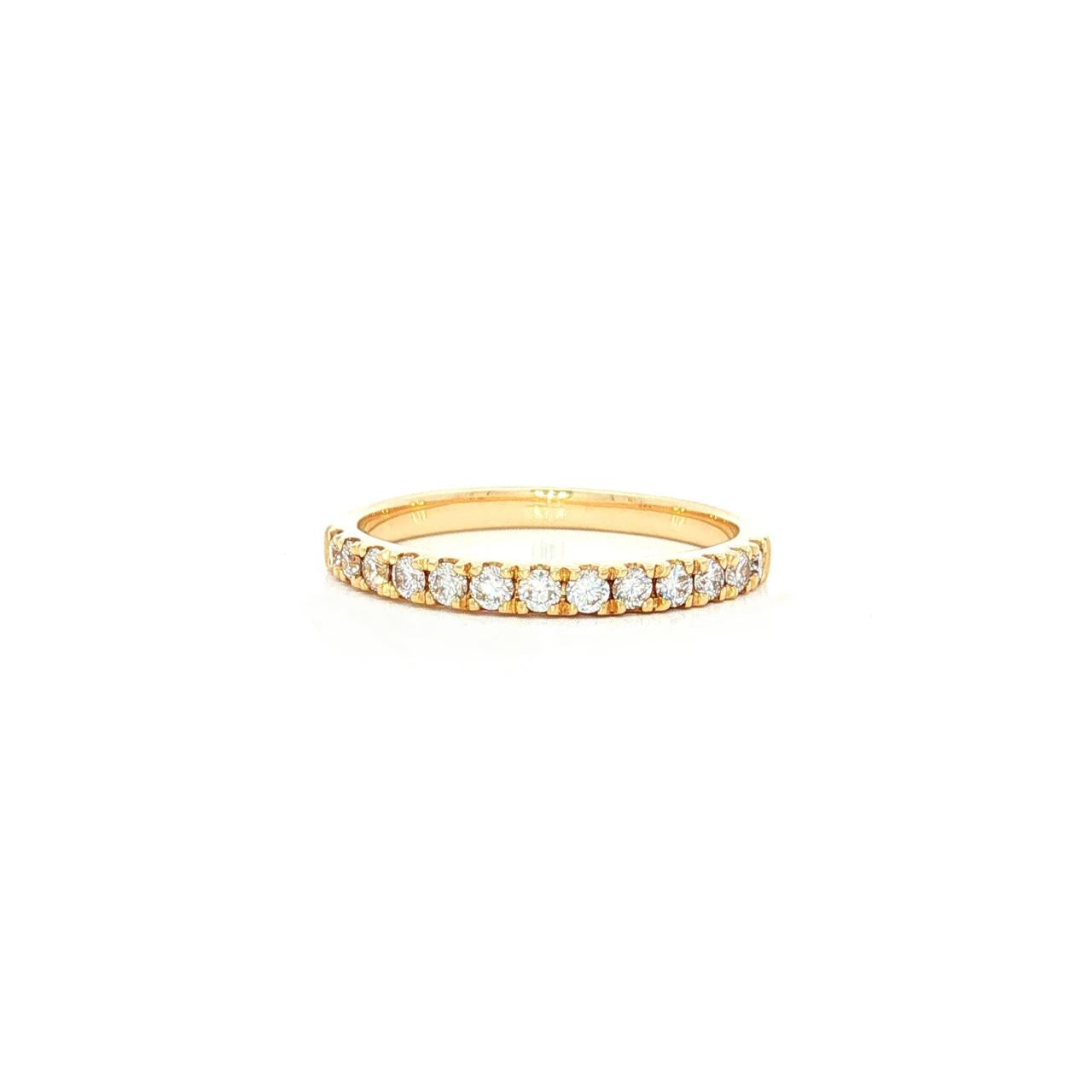Diamond band in yellow gold with round brilliant cut diamonds