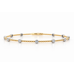 18ct yellow gold beaded bangle featuring eleven round brilliant cut diamonds in contrasting white gold bezel settings, totalling 0.38ct.