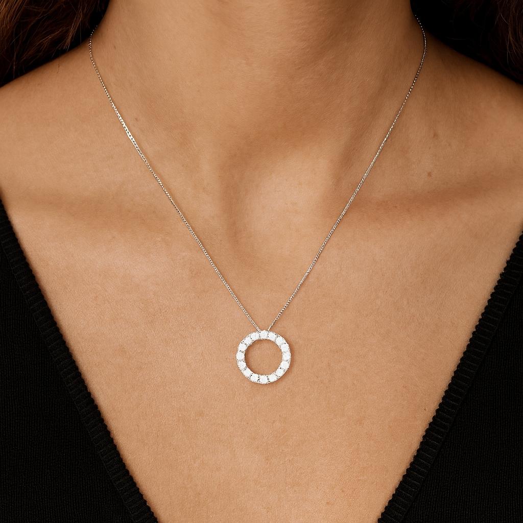 18ct white gold Diamond Circle of Life Pendant featuring a 12mm open circle with claw-set round brilliant cut diamonds totalling 0.54ct.