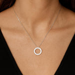 18ct white gold Diamond Circle of Life Pendant featuring a 12mm open circle with claw-set round brilliant cut diamonds totalling 0.54ct.