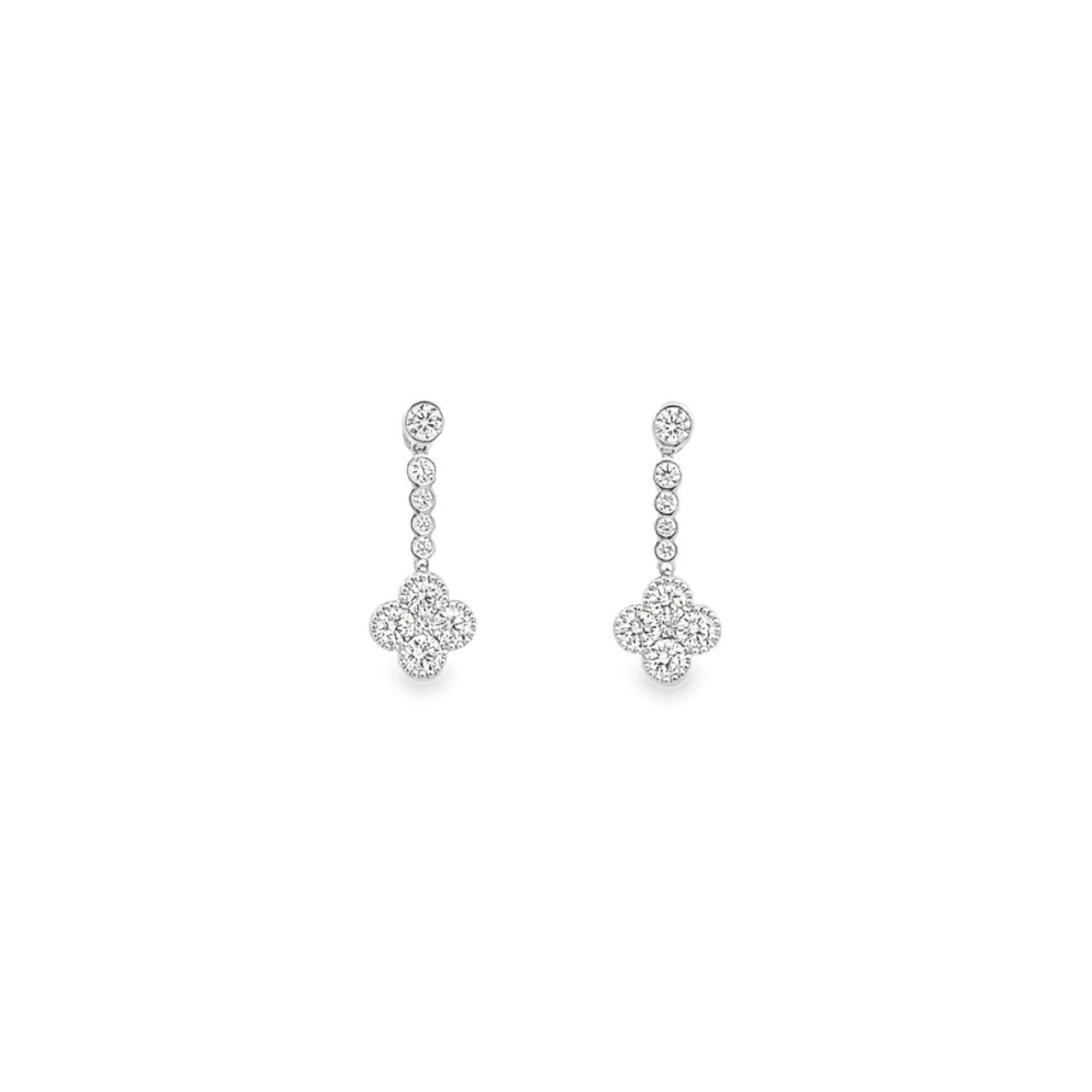 18ct white gold diamond clover drop earrings with articulated bezel-set diamonds and clover-shaped cluster drops, featuring 0.94ct of G–H colour, SI clarity diamonds.