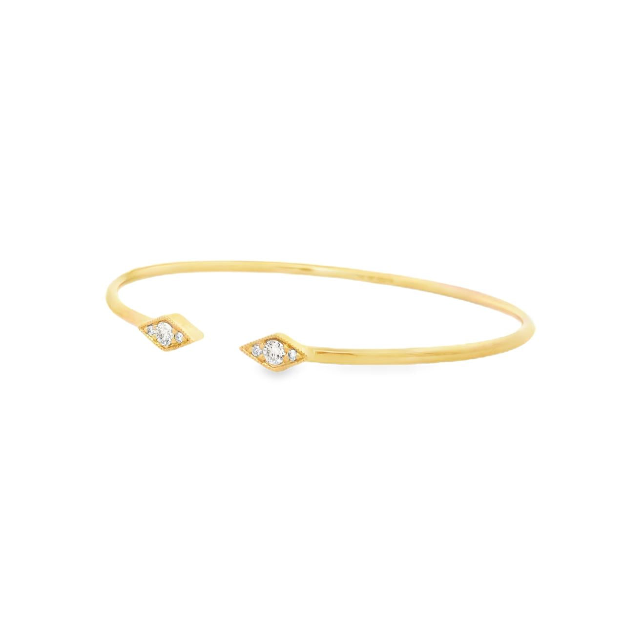 18ct yellow gold diamond bangle with oval profile and open gap at the top, featuring two rhombus-shaped cluster sections set with 6 round brilliant cut diamonds and finished with delicate millgrain detailing.