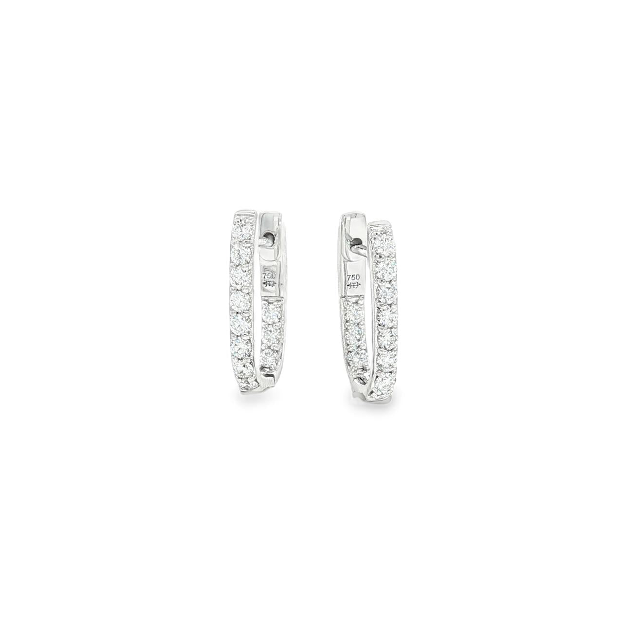 18ct white gold diamond huggie earrings featuring a hinged “U”-shape design with claw-set diamonds along the front and inside back.