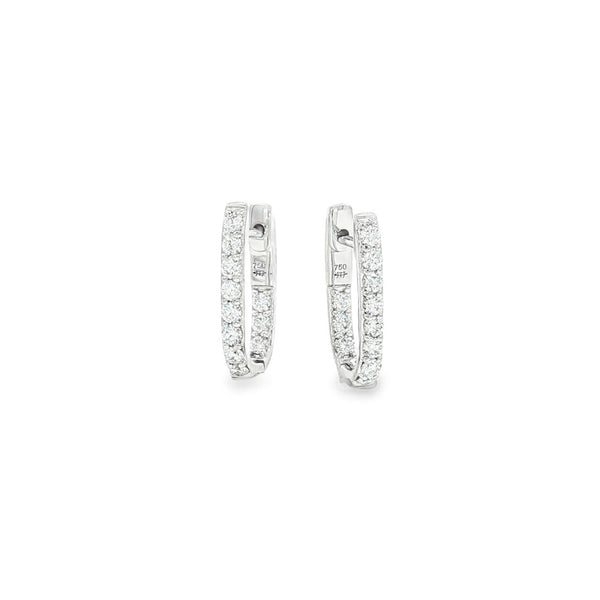 18ct white gold diamond huggie earrings featuring a hinged “U”-shape design with claw-set diamonds along the front and inside back.