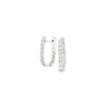 18ct white gold diamond huggie earrings featuring a hinged “U”-shape design with claw-set diamonds along the front and inside back.