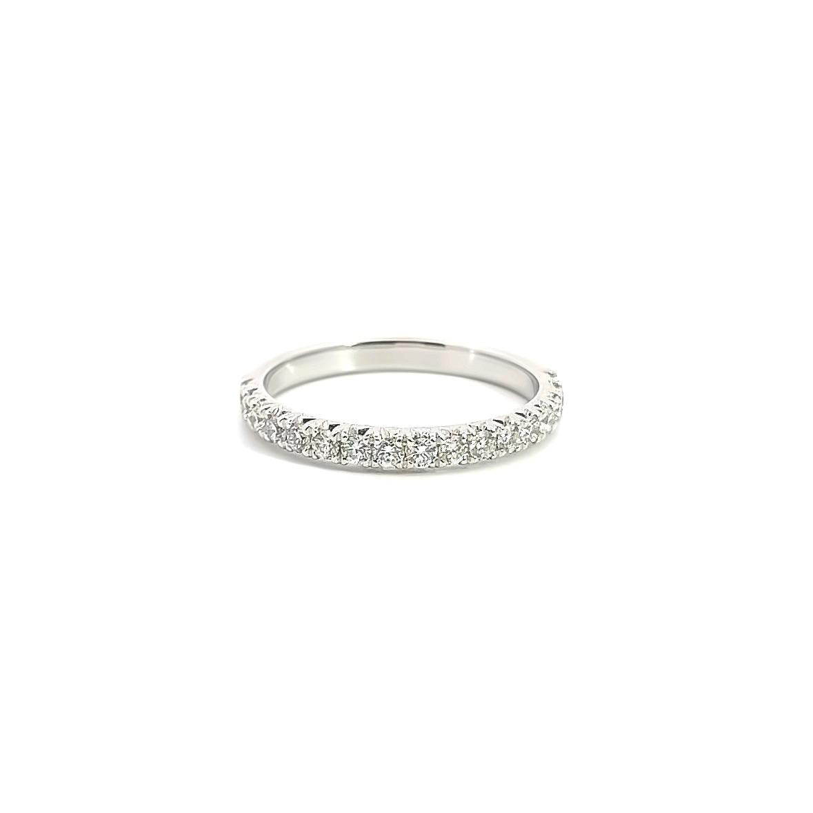 18ct white gold low-profile wedding ring featuring seventeen round brilliant cut diamonds totalling 0.45ct in a claw setting across the top.