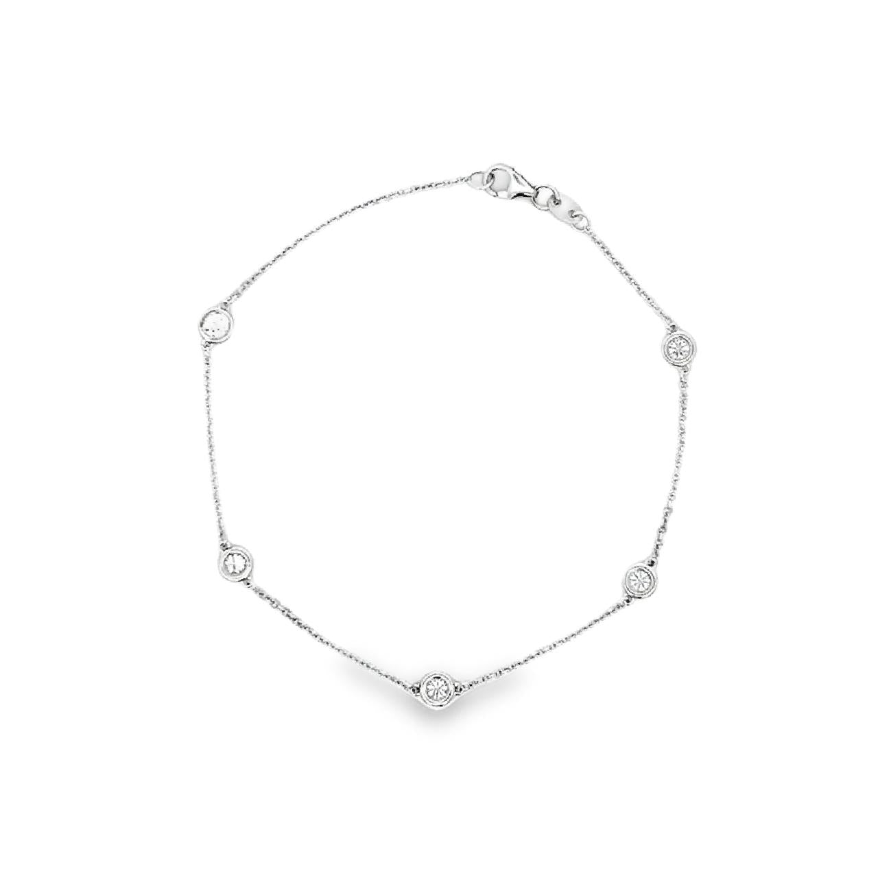 18ct white gold diamond bracelet featuring a fine trace link chain, central circular mini disc with bead-set diamond cluster, bezel-set diamonds along the length, and an adjustable parrot clasp.