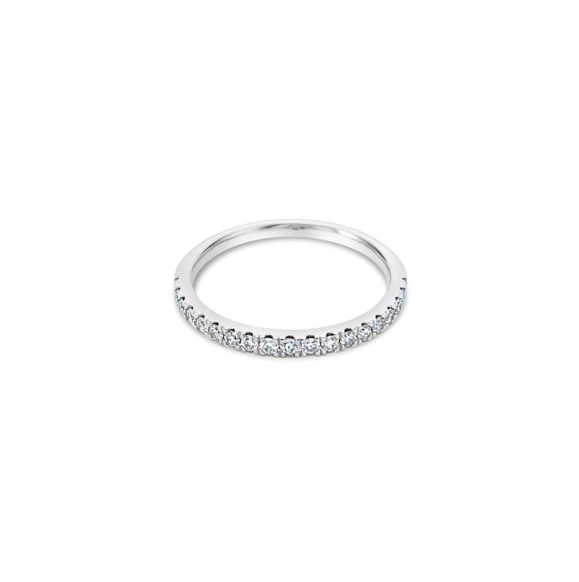 Platinum diamond wedding ring featuring seventeen claw-set round brilliant cut diamonds across the band.