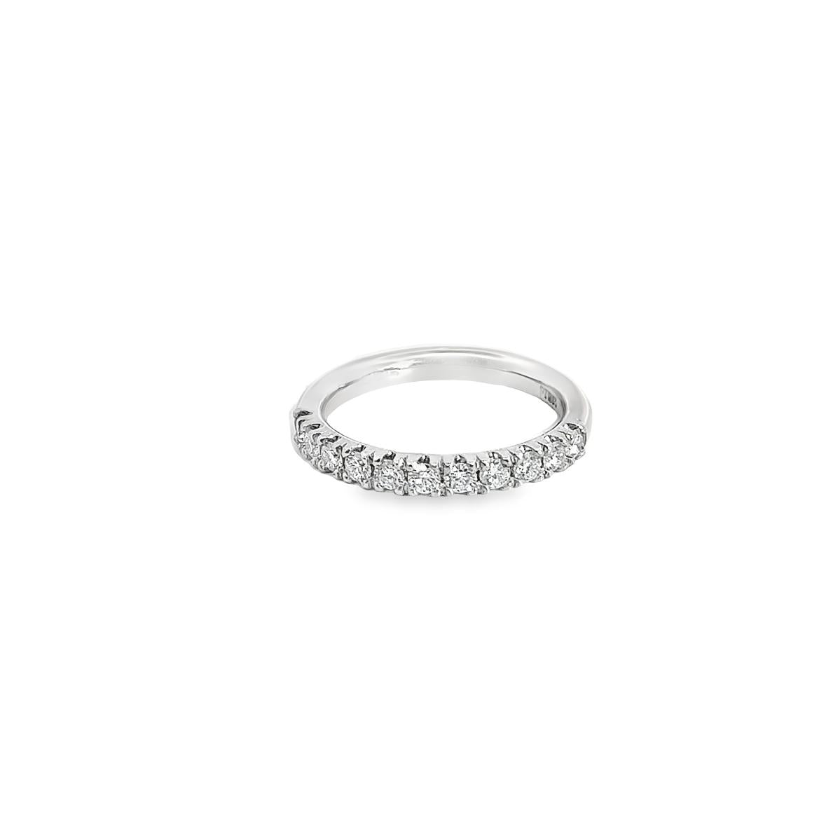 Platinum wedding ring featuring eleven round brilliant cut diamonds totalling 0.47ct in a claw setting across the top.