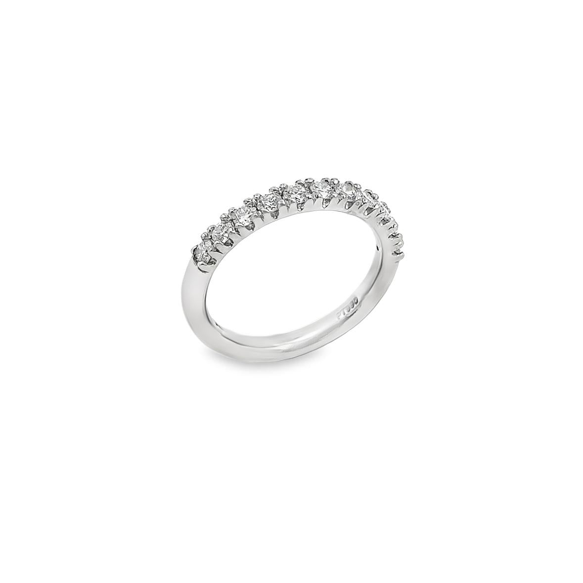 Platinum wedding ring featuring eleven round brilliant cut diamonds totalling 0.47ct in a claw setting across the top.