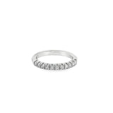 Platinum wedding ring featuring eleven claw-set round brilliant cut diamonds across the top of the band.