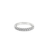 Platinum wedding ring featuring eleven claw-set round brilliant cut diamonds across the top of the band.