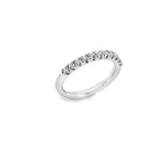 Platinum wedding ring featuring eleven claw-set round brilliant cut diamonds across the top of the band.
