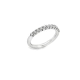 Platinum wedding ring featuring eleven claw-set round brilliant cut diamonds across the top of the band.