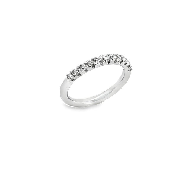 Platinum wedding ring featuring eleven claw-set round brilliant cut diamonds across the top of the band.