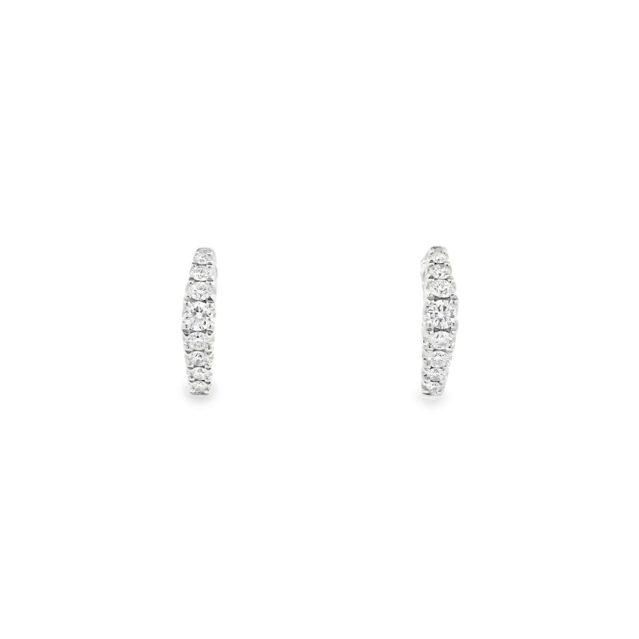 18ct white gold huggie earrings with distinctive diamond-shaped profile, featuring 16 round brilliant cut diamonds set down the front, hinged with clip catch fittings.