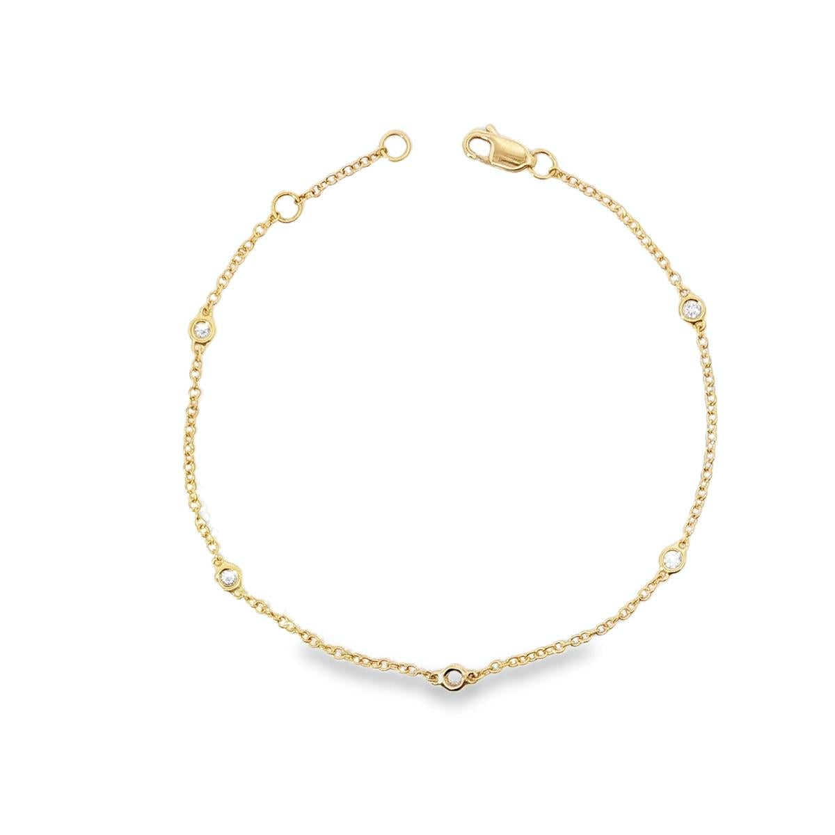 18ct yellow gold bracelet with bezel set diamond stations along fine chain