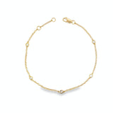 18ct yellow gold bracelet with bezel set diamond stations along fine chain