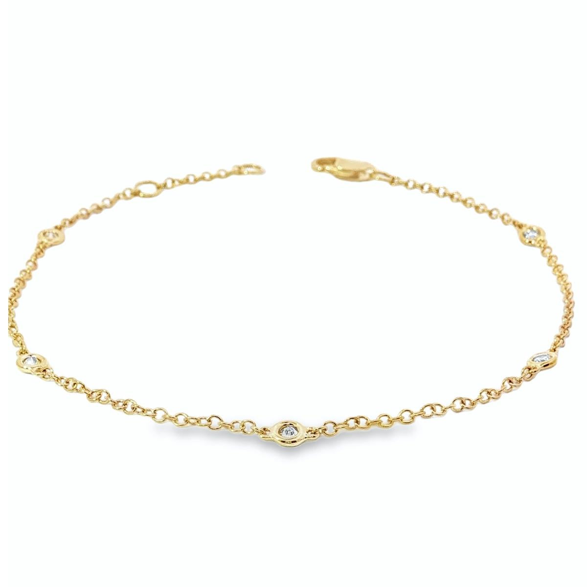 18ct yellow gold bracelet with bezel set diamond stations along fine chain