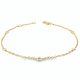 18ct yellow gold bracelet with bezel set diamond stations along fine chain