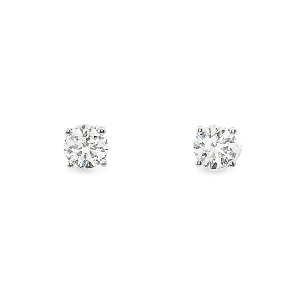 18ct white gold diamond stud earrings featuring a matched pair of round brilliant cut diamonds totalling 1.41ct in four-claw settings with post and butterfly fittings.