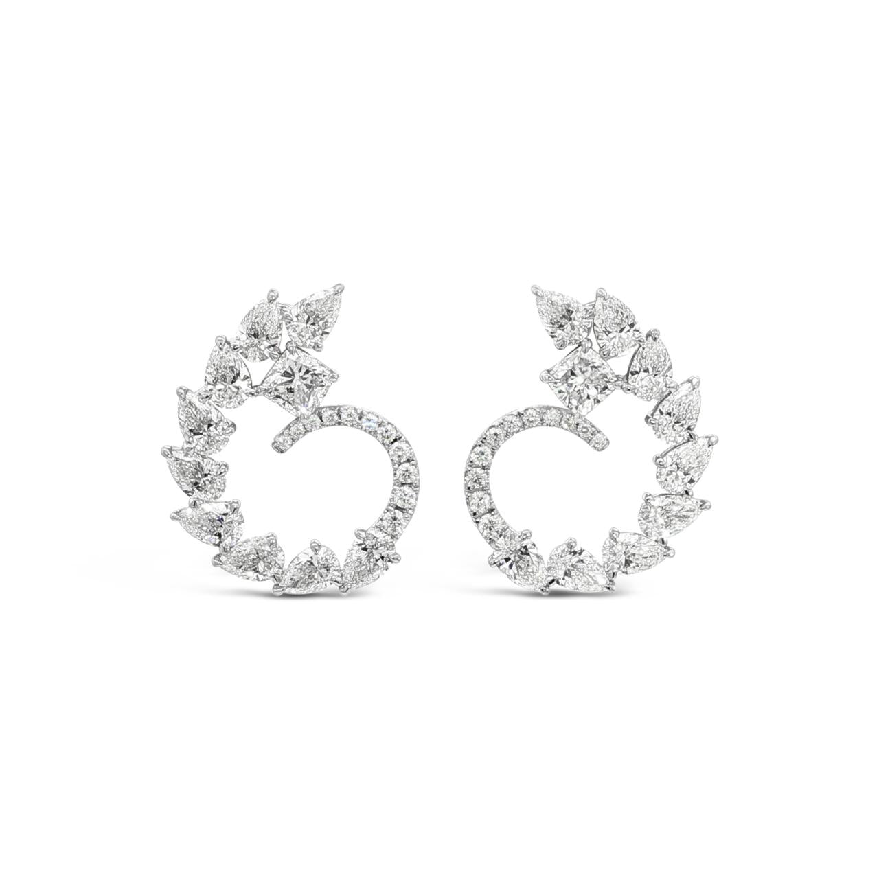 18ct white gold diamond swirl cluster stud earrings with four-claw centre and graduating halo of pear and round brilliant cut diamonds, post and butterfly fittings.