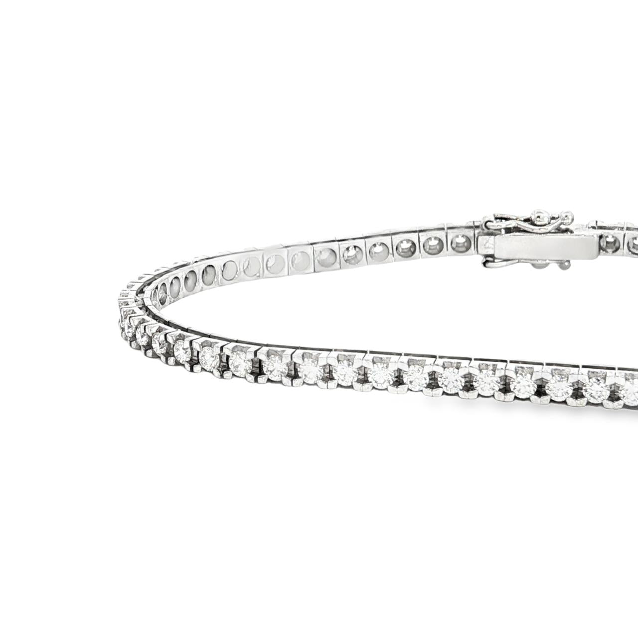18ct white gold diamond tennis bracelet with 62 round brilliant cut diamonds in four claw settings