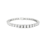 18ct white gold diamond tennis bracelet featuring thirty-six round brilliant cut diamonds totalling 11.36ct, in four-claw settings with a secure slide catch and fold-over clasps.