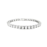 18ct white gold diamond tennis bracelet featuring thirty-six round brilliant cut diamonds totalling 11.36ct, in four-claw settings with a secure slide catch and fold-over clasps.