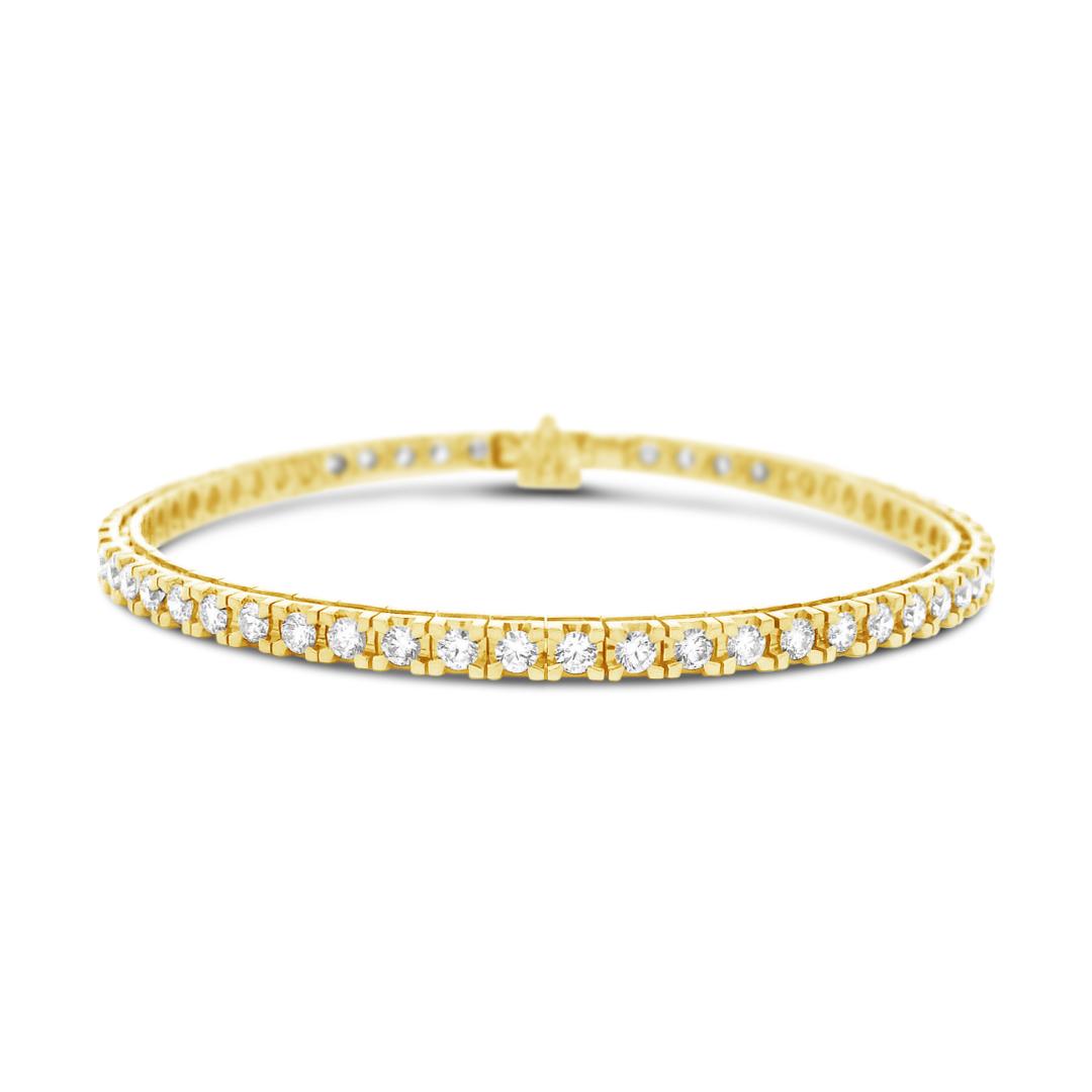 18ct yellow gold diamond tennis bracelet featuring fifty-eight round brilliant cut diamonds totalling 3.02ct, four-claw settings, and a secure slide catch with fold-over clasp.
