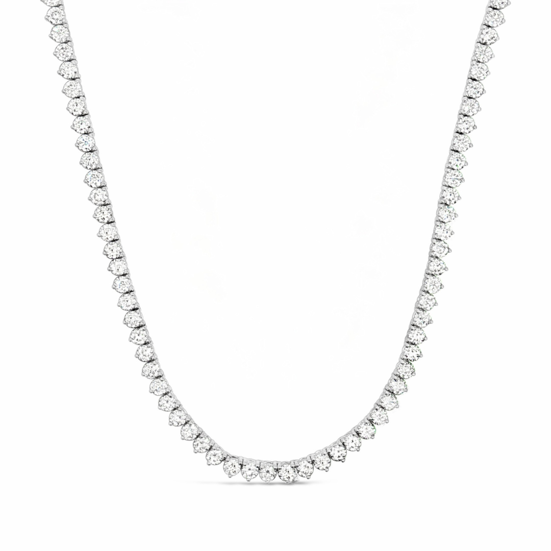 18ct white gold diamond tennis necklet featuring 152 round brilliant cut diamonds totalling 12.35ct (J/SI2) in three-claw settings with a slide clasp and fold-over catch.
