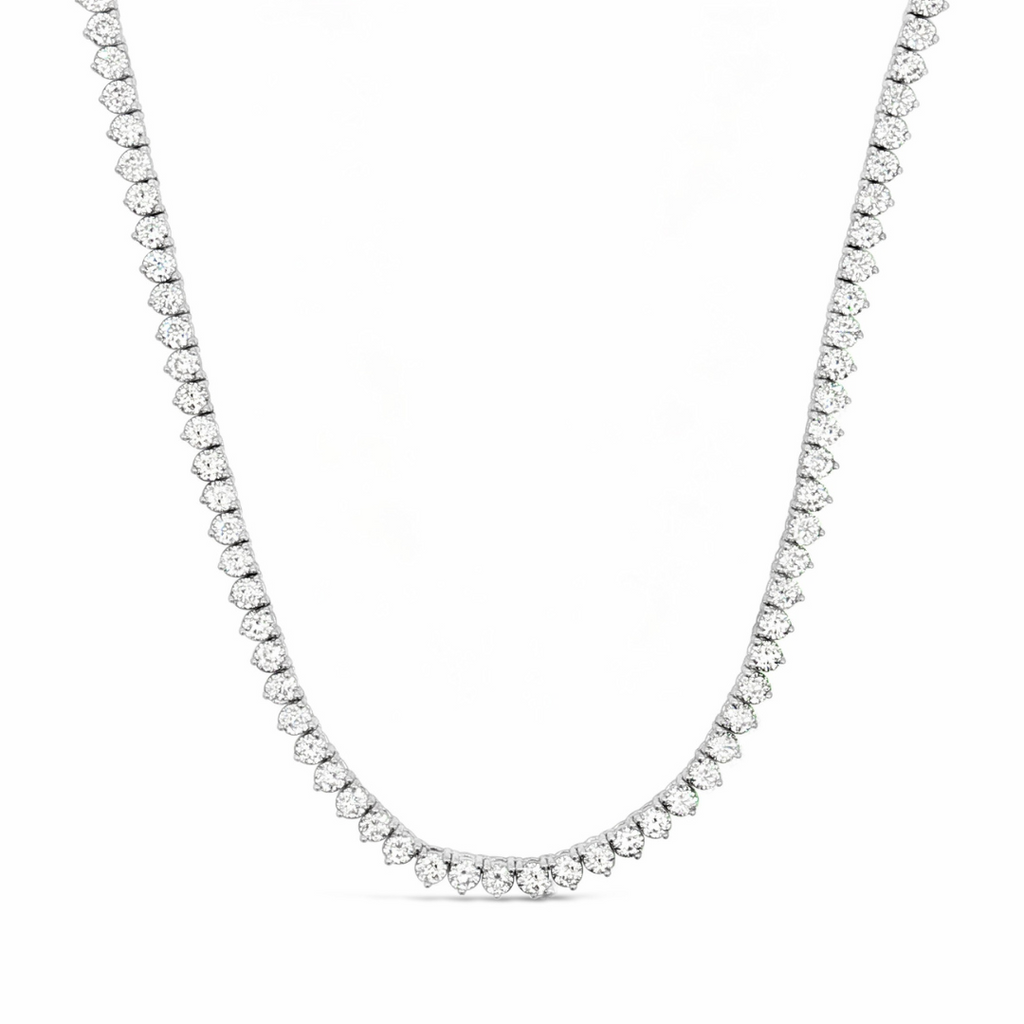 18ct white gold diamond tennis necklet featuring 152 round brilliant cut diamonds totalling 12.35ct (J/SI2) in three-claw settings with a slide clasp and fold-over catch.