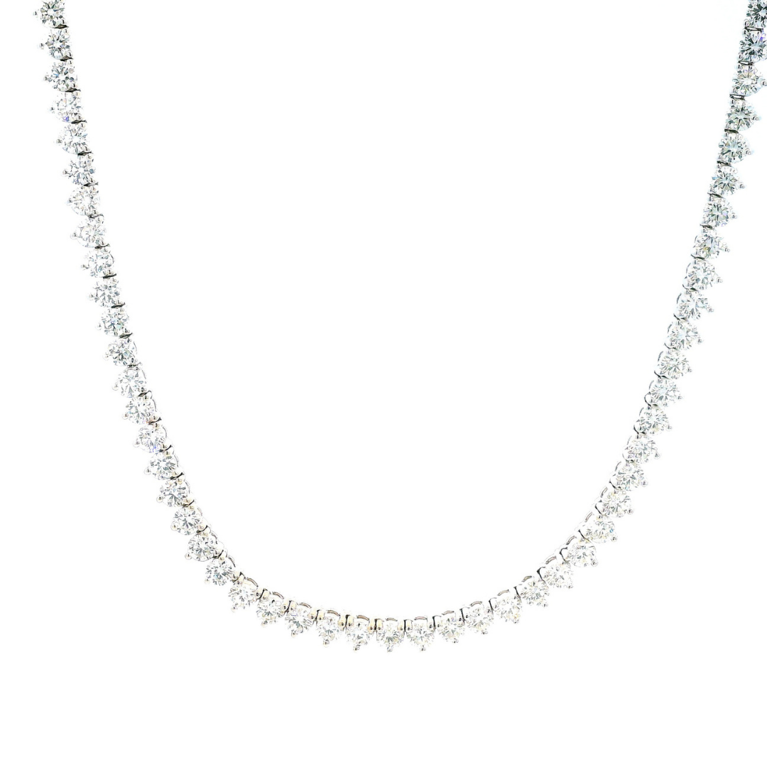 18ct white gold diamond tennis necklet with 152 round brilliant cut diamonds in three-claw settings and a secure slide clasp.
