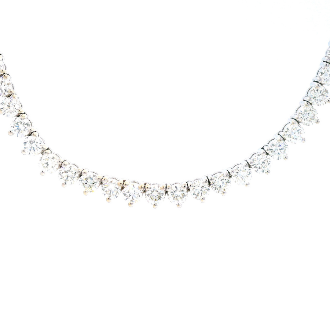 18ct white gold diamond tennis necklet with 152 round brilliant cut diamonds in three-claw settings and a secure slide clasp.