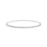 18ct white gold diamond bangle featuring forty-five claw-set round brilliant cut diamonds across the top, oval profile with hinged opening and slide catch fastening.