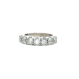 18ct white gold ring featuring seven round brilliant cut diamonds totalling 1.38ct in a straight row shared claw setting with curved undercarriage.