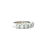 18ct white gold ring featuring seven round brilliant cut diamonds totalling 1.38ct in a straight row shared claw setting with curved undercarriage.