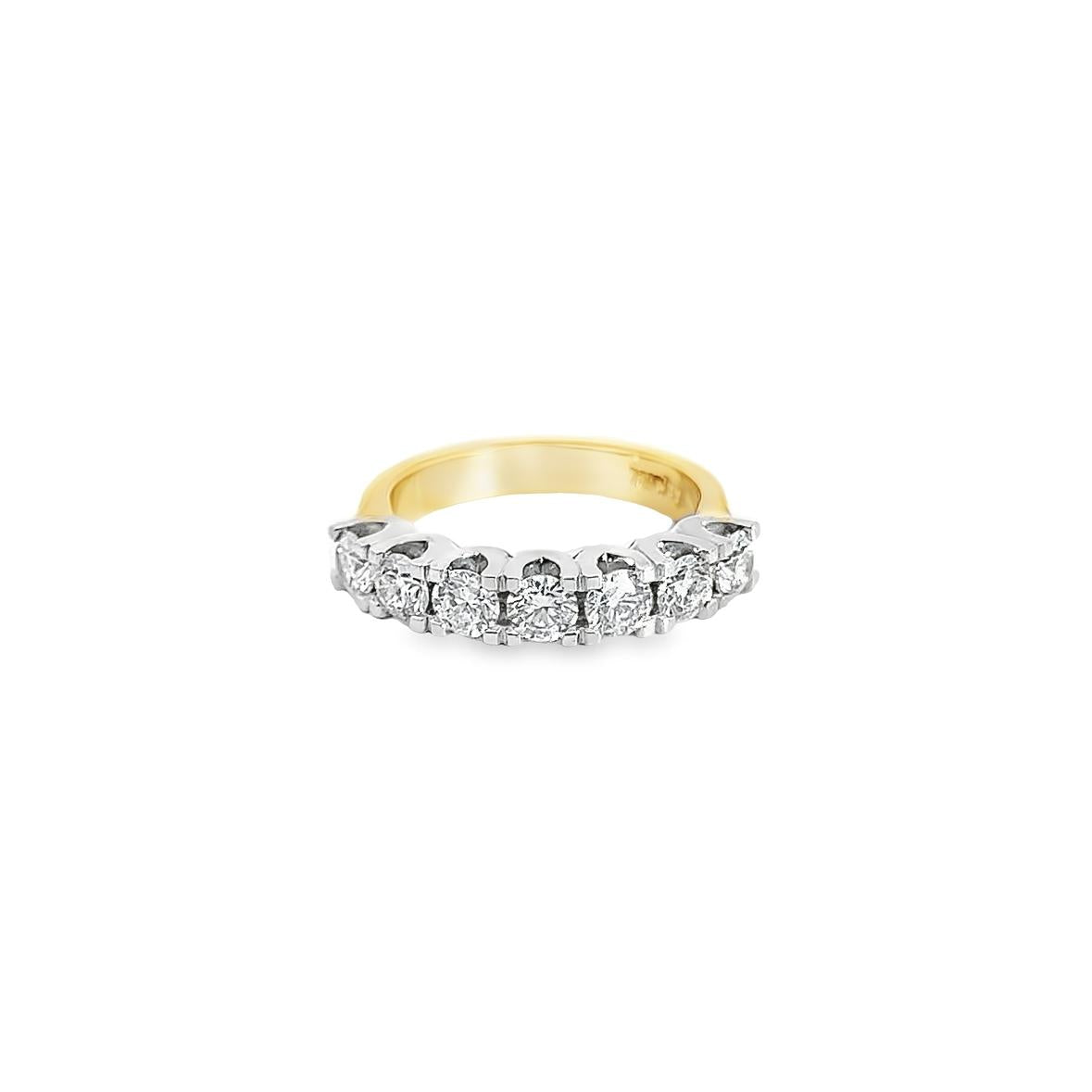 18ct yellow and white gold ring featuring seven round brilliant cut diamonds totalling 1.38ct in a shared claw setting with curved undercarriage.