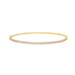 18ct yellow gold diamond bangle featuring forty-five claw-set round brilliant cut diamonds across the top, oval profile with hinged opening and slide catch fastening.