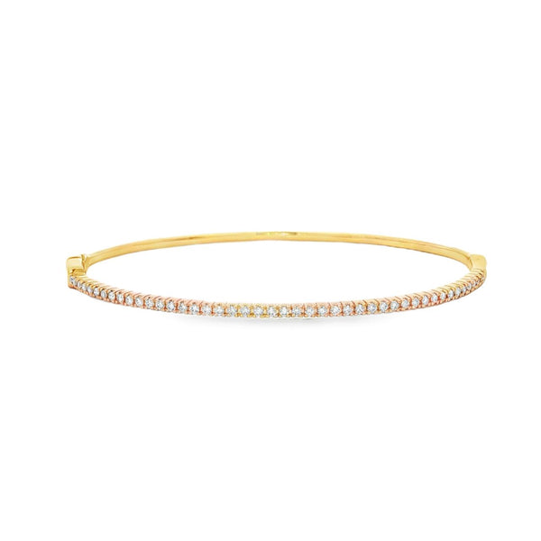 18ct yellow gold diamond bangle featuring forty-five claw-set round brilliant cut diamonds across the top, oval profile with hinged opening and slide catch fastening.
