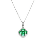 18ct white gold clover-shaped pendant featuring a cluster of princess and oval-cut emeralds surrounded by round brilliant cut diamonds with a graduating diamond-set pendant runner.