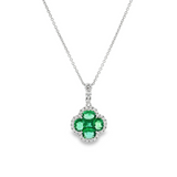 18ct white gold clover-shaped pendant featuring a cluster of princess and oval-cut emeralds surrounded by round brilliant cut diamonds with a graduating diamond-set pendant runner.