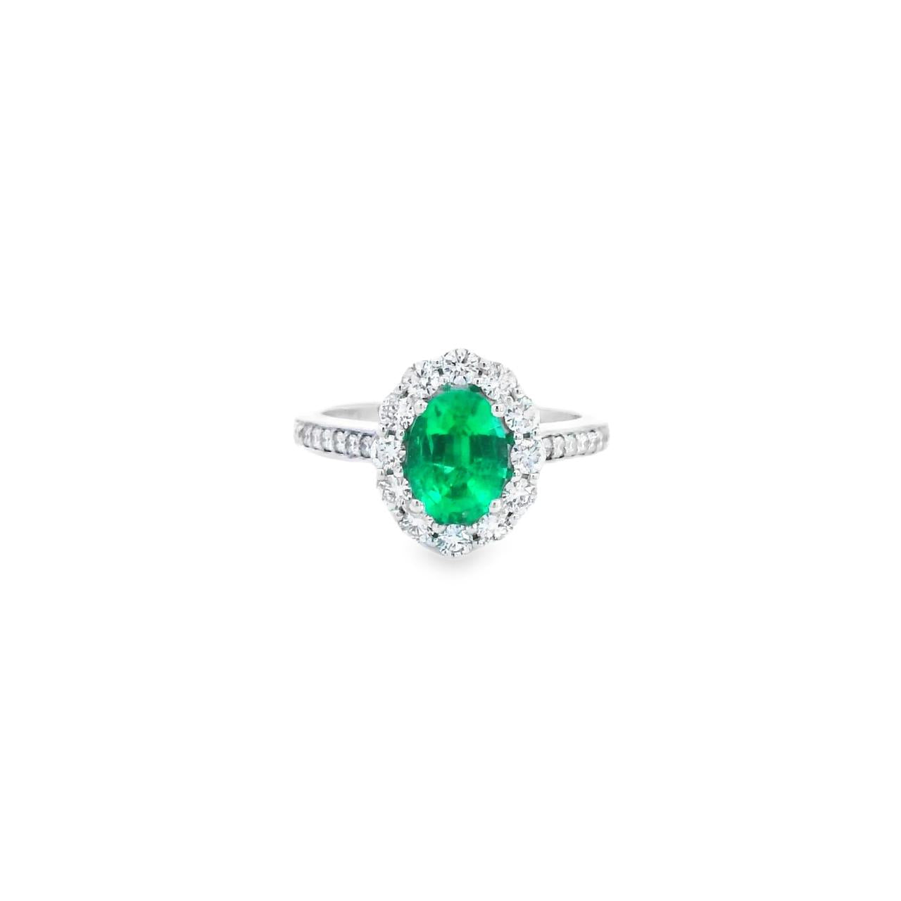 18ct white gold emerald and diamond halo ring featuring an oval emerald with a scalloped diamond surround and bead-set shoulders, size N (resizeable).