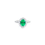18ct white gold emerald and diamond halo ring featuring an oval emerald with a scalloped diamond surround and bead-set shoulders, size N (resizeable).