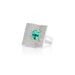 Platinum emerald and diamond ring featuring a 2.93ct emerald-cut centre stone with pavé diamond open book–style surround.